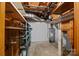 Unfinished basement area with shelving and water heater, perfect for storage or renovation at 303 Jean Ave, Kannapolis, NC 28083
