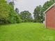 Expansive backyard with mature trees, perfect for outdoor activities and relaxation at 3055 16Th Ne St, Hickory, NC 28601