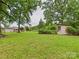 Wide backyard with outbuildings and grass at 3055 16Th Ne St, Hickory, NC 28601
