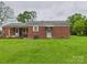 Brick home with an open backyard and a covered patio area, perfect for outdoor enjoyment at 3055 16Th Ne St, Hickory, NC 28601