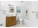 Bright bathroom featuring a single vanity with a wood cabinet and a shower-tub combo at 3055 16Th Ne St, Hickory, NC 28601
