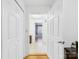 Hallway with hardwood flooring leads to the bedrooms and bathrooms at 3055 16Th Ne St, Hickory, NC 28601
