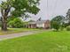 Charming single-story home with a covered front porch and well-manicured lawn at 3055 16Th Ne St, Hickory, NC 28601