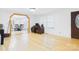 Bright, open-concept living room with wood floors and seamless flow to dining area at 3055 16Th Ne St, Hickory, NC 28601