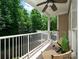 Relaxing balcony with seating and views of the lush, green surroundings at 3248 Margellina Dr, Charlotte, NC 28210