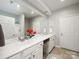 Bathroom with double sink vanity, large mirror and neutral color scheme offers a bright and clean design at 3248 Margellina Dr, Charlotte, NC 28210