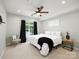 Bright bedroom featuring a ceiling fan, carpet flooring and a large window at 3248 Margellina Dr, Charlotte, NC 28210