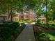 Apartment building exterior with landscaped grounds and a charming gazebo showcasing community amenities and curb appeal at 3248 Margellina Dr, Charlotte, NC 28210