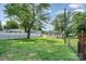Large, grassy backyard enclosed by fencing offering ample green space at 330 Central Ave, Kannapolis, NC 28081