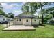 Back of house features a wooden deck in a fenced backyard with grass at 330 Central Ave, Kannapolis, NC 28081