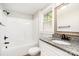 Updated bathroom with granite counters, modern fixtures, and a shower-tub combo at 330 Central Ave, Kannapolis, NC 28081
