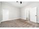 Bedroom features neutral carpet, ceiling fan, closet, and door to adjacent room at 330 Central Ave, Kannapolis, NC 28081