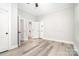 Bedroom featuring gray flooring, a ceiling fan, and access to a bathroom at 330 Central Ave, Kannapolis, NC 28081