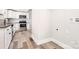 Modern kitchen features stainless steel appliances, white cabinets, and granite countertops at 330 Central Ave, Kannapolis, NC 28081