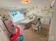 A playful bedroom with vibrant wall decals, a cozy bed, and a table set for creative play at 3416 Yarmouth Ln, Gastonia, NC 28056