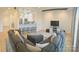 Spacious living area with a large sectional sofa, a kitchen bar with seating, and modern decor at 3416 Yarmouth Ln, Gastonia, NC 28056