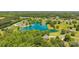 Aerial view of a gorgeous lake surrounded by lush trees and beautiful homes at 364 Luther Dr, Iron Station, NC 28080