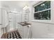 Bathroom with granite vanity and a walk-in shower, complete with a checkered rug at 364 Luther Dr, Iron Station, NC 28080