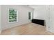 Bright bedroom with hardwood floors, neutral paint, and two windows for natural light at 364 Luther Dr, Iron Station, NC 28080