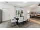 Open-concept dining room showcasing stylish decor, leading into a cozy living area with ample natural light at 364 Luther Dr, Iron Station, NC 28080