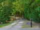 Driveway with gated entrance and a mailbox with '364 Judge Drive' on a stone at 364 Luther Dr, Iron Station, NC 28080