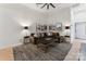 Cozy living room features a dark grey rug, a brown sofa and black and gold accents at 364 Luther Dr, Iron Station, NC 28080