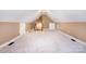 An attic conversion provides an open, versatile space with neutral walls and carpet at 3917 Erskine Woods Dr, Bessemer City, NC 28016