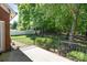 Home backyard with a patio, fence, and views of the trees in the surrounding area at 3917 Erskine Woods Dr, Bessemer City, NC 28016
