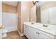 Bathroom features double vanity, ceramic tile flooring, and tub and shower with glass doors at 3917 Erskine Woods Dr, Bessemer City, NC 28016