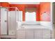 Bathroom suite features a large soaking tub, a separate shower and dramatic colors at 3917 Erskine Woods Dr, Bessemer City, NC 28016
