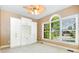 Bright bedroom featuring a ceiling fan, a large window with natural light, and a built-in storage unit at 3917 Erskine Woods Dr, Bessemer City, NC 28016