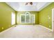 Large bedroom includes a trey ceiling and oversized window allowing for plenty of natural light at 3917 Erskine Woods Dr, Bessemer City, NC 28016