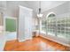 Sunny dining area with vaulted ceiling features a built-in desk and large window at 3917 Erskine Woods Dr, Bessemer City, NC 28016