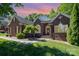 Charming brick home features a well-manicured lawn and a traditional design with black shutters at 3917 Erskine Woods Dr, Bessemer City, NC 28016
