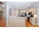 Open kitchen with white countertops, stainless steel appliances, and a breakfast bar at 3917 Erskine Woods Dr, Bessemer City, NC 28016