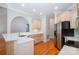 Well-lit kitchen featuring white countertops, stainless steel appliances, and ample cabinet space at 3917 Erskine Woods Dr, Bessemer City, NC 28016