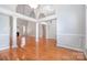 Bright open-plan living and dining area with high ceilings, hardwood floors and natural light at 3917 Erskine Woods Dr, Bessemer City, NC 28016