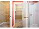 Walk-in closet with shelving is located just off of the bathroom suite at 3917 Erskine Woods Dr, Bessemer City, NC 28016
