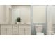 Elegant bathroom featuring a double vanity, a classic toilet, and a framed art piece, offering a spa-like experience at 4247 Skyboat Cir, Fort Mill, SC 29715