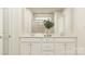 Bright bathroom featuring a double vanity with white cabinetry, quartz countertops, and a glass-enclosed shower at 4247 Skyboat Cir, Fort Mill, SC 29715