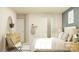 Comfortable bedroom featuring a bed with soft pillows, a wooden dresser, and an open closet at 4247 Skyboat Cir, Fort Mill, SC 29715