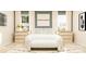 Inviting bedroom featuring calming decor, abundant pillows, and bright, natural light through the two large windows at 4247 Skyboat Cir, Fort Mill, SC 29715