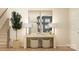 Bright entryway with modern console table, stylish lamps, decorative mirrors, and a staircase at 4247 Skyboat Cir, Fort Mill, SC 29715