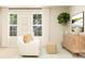 Cozy living room featuring a comfortable white sofa, a natural fiber cube, and a stylish wooden cabinet at 4247 Skyboat Cir, Fort Mill, SC 29715