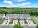 Aerial view of townhomes with driveways, garages, and lush trees at 45008 Wigeon Ln # 202, Indian Land, SC 29707