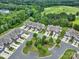 Aerial view showcasing townhomes and a scenic golf course in a lush, green neighborhood at 45008 Wigeon Ln # 202, Indian Land, SC 29707