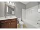 This bathroom has a shower-tub combo with silver fixtures and a brown vanity sink at 45008 Wigeon Ln # 202, Indian Land, SC 29707