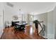 Bright dining room featuring hardwood floors, elegant lighting, and neutral decor at 45008 Wigeon Ln # 202, Indian Land, SC 29707