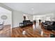Wide-open living room with hardwood floors, leather seating, and neutral colored walls at 45008 Wigeon Ln # 202, Indian Land, SC 29707