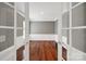 Home office space with hardwood floors, white wainscoting, and French doors at 45008 Wigeon Ln # 202, Indian Land, SC 29707